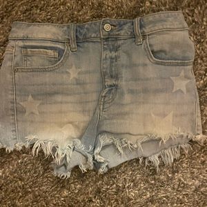 faded blue jean shorts with stars